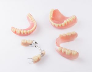 Group of dentures on white background