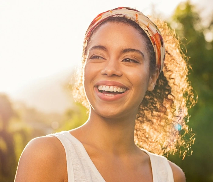 Woman smiling outside